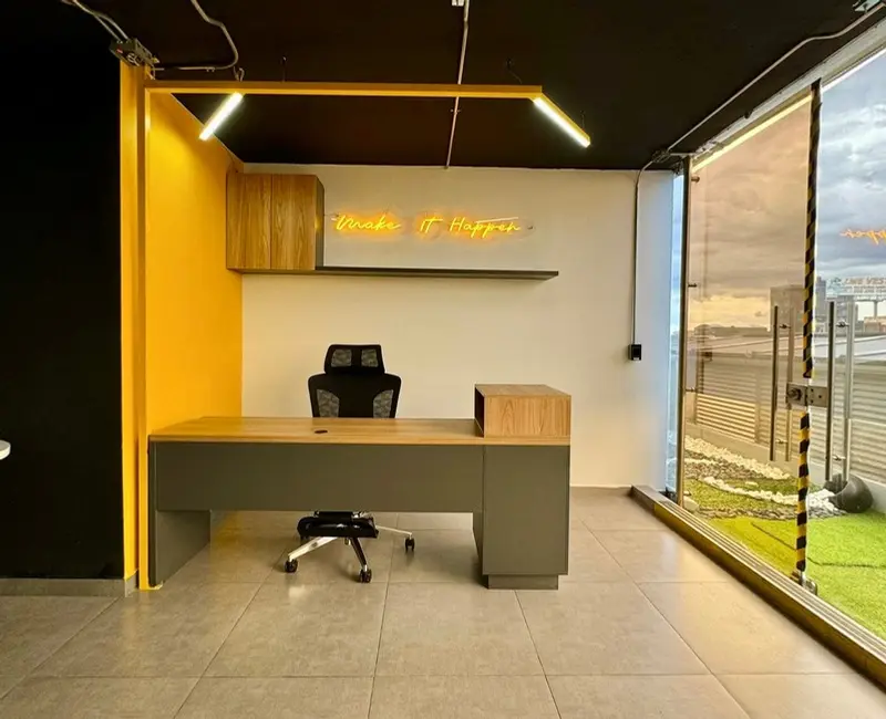 Fotografía de obra terminada: oficina y jardín de piedra. Oficinas con zona recreativa en Bogotá, Decord Design